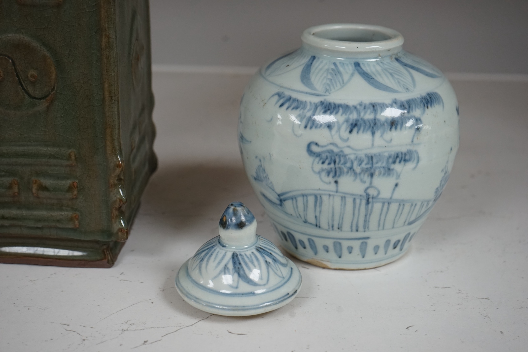 A Chinese celadon glazed cong vase and a blue and white jar and cover, tallest 22cm. Condition - good